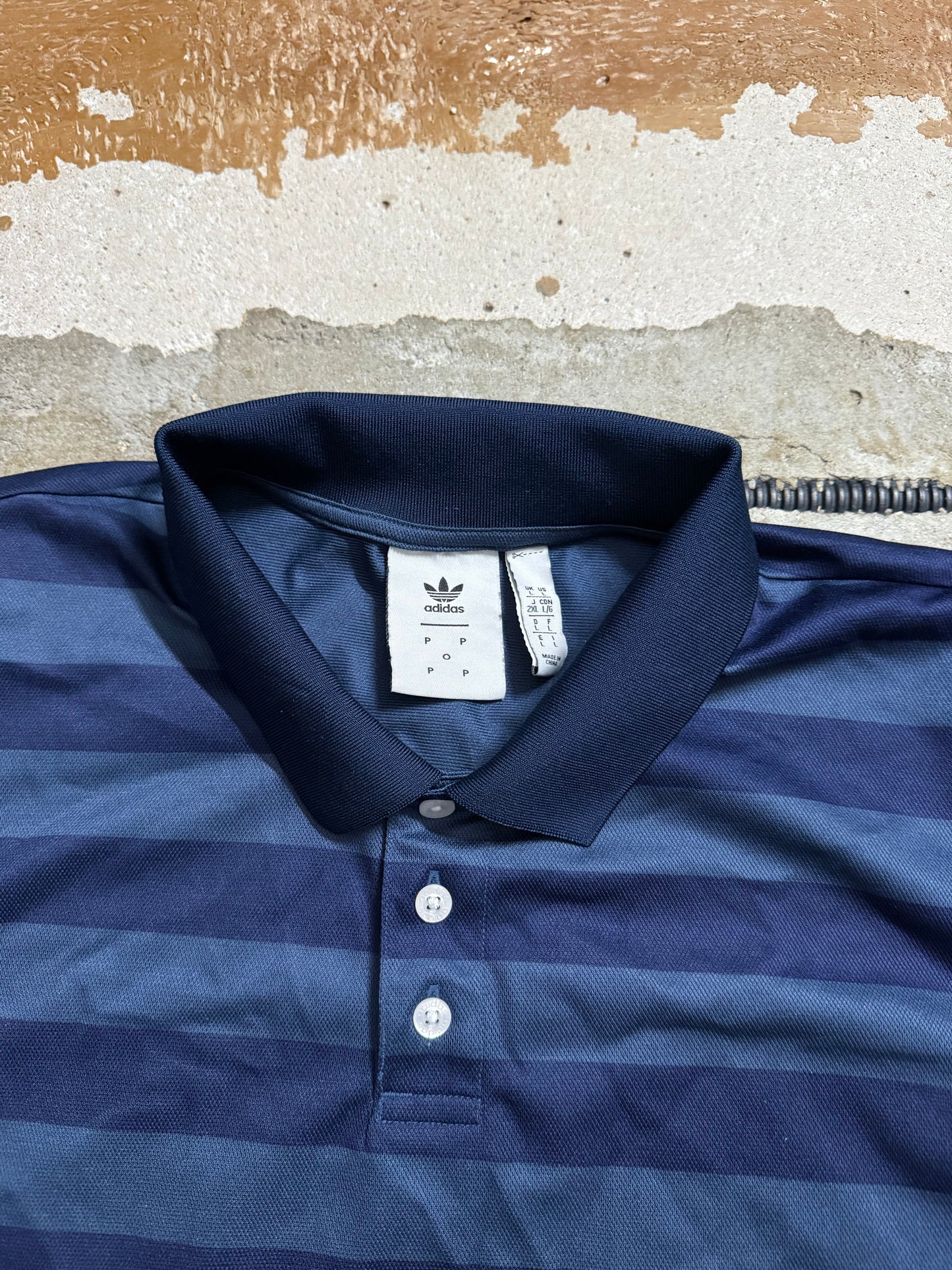 Adidas x Pop trading company polo shirt - L